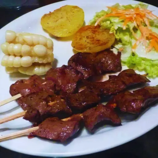 Experience the bold flavors of Peru with our Anticuchos at Se Llama Perú. Tender beef heart, marinated to perfection in a blend of spices and Peruvian seasonings, is grilled to succulent perfection.