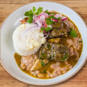 Combo plate of breef in cilantro sauce, steamed rice & beans