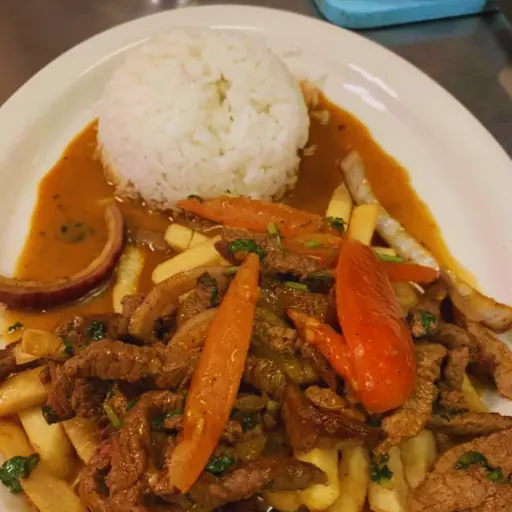 Succulent strips of steak are expertly stir-fried with onions, tomatoes, and our signature blend of special seasonings, creating a tantalizing medley of tastes and textures.