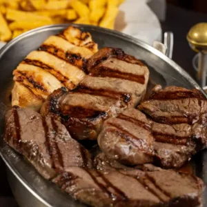 Grilled steak with fries and salad