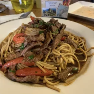 Tender strips of steak are expertly stir-fried with onions and tomatoes, then sautéed in our special sauce to perfection. Each bite offers a harmonious blend of savory steak, caramelized onions, and juicy tomatoes, infused with the rich flavors of our secret sauce.